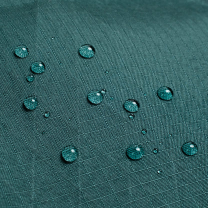 General shot of Topo Designs Global Pro Tech Case water droplets on waterproof material